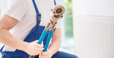 plumber holding large tool ontario ca